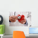 Doctor holding heart Wall Decal