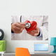 Doctor holding heart Wall Decal