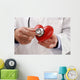 Doctor holding heart Wall Decal