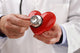 Doctor holding heart Wall Decal