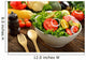 Fruit and vegetable salad in a bowl on wooden table Wall Decal