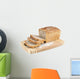 Cut wholemeal bread on a chopping board Wall Decal