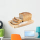 Cut wholemeal bread on a chopping board Wall Decal