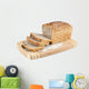 Cut wholemeal bread on a chopping board Wall Decal