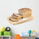 Cut wholemeal bread on a chopping board Wall Decal