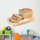 Cut wholemeal bread on a chopping board Wall Decal