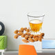 Dessert liqueur Amaretto with almond nuts, isolated on white Wall Decal