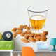 Dessert liqueur Amaretto with almond nuts, isolated on white Wall Decal