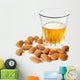 Dessert liqueur Amaretto with almond nuts, isolated on white Wall Decal