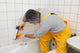 Worker Plumber Caulking Bath Wall Decal