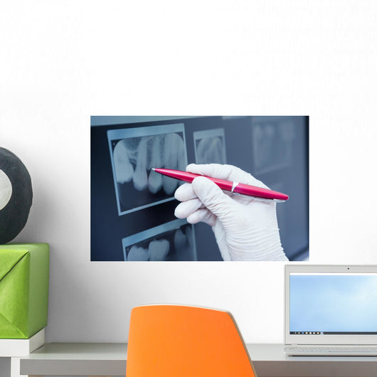 Gloved hand holding pen to teeth x-ray Wall Decal