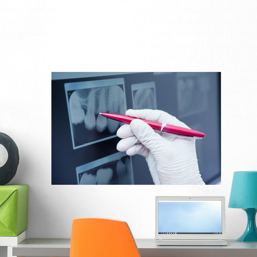 Gloved hand holding pen to teeth x-ray Wall Decal