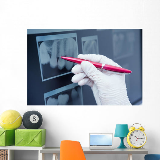 Gloved hand holding pen to teeth x-ray Wall Decal