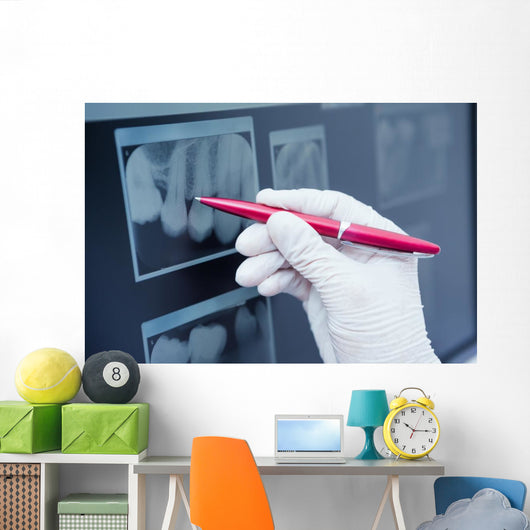 Gloved hand holding pen to teeth x-ray Wall Decal