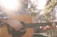 A folk country musician playing his guitar. Wall Decal