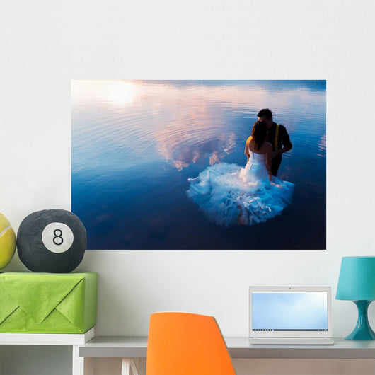 bride and groom on the water in the lake, trash the dress Wall Decal