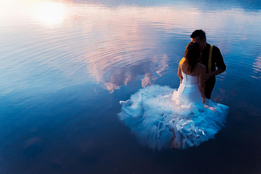 bride and groom on the water in the lake, trash the dress Wall Decal