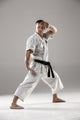 Man in white kimono training karate Wall Decal