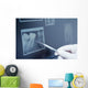 Gloved hand holding dental tool to teeth x-ray Wall Decal