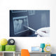 Gloved hand holding dental tool to teeth x-ray Wall Decal