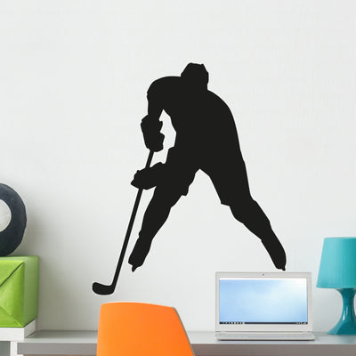 Hockey Player Vector Silhouette Wall Decal shown on a wall