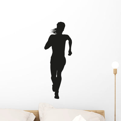 Silhouette Of A Woman Running Long Distance Wall Decal shown on a wall