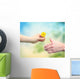 Young woman giving a dandelion to senior woman Wall Decal