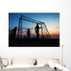 Boys playing football on the beach in summer Wall Decal