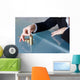Businesswoman building growing euro columns Wall Decal