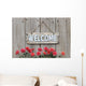 Welcome sign with row of mums by wood fence Wall Decal