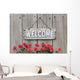 Welcome sign with row of mums by wood fence Wall Decal