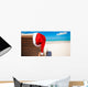 Red santa hat on chair longue at tropical caribbean beach Wall Decal