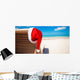 Red santa hat on chair longue at tropical caribbean beach Wall Decal