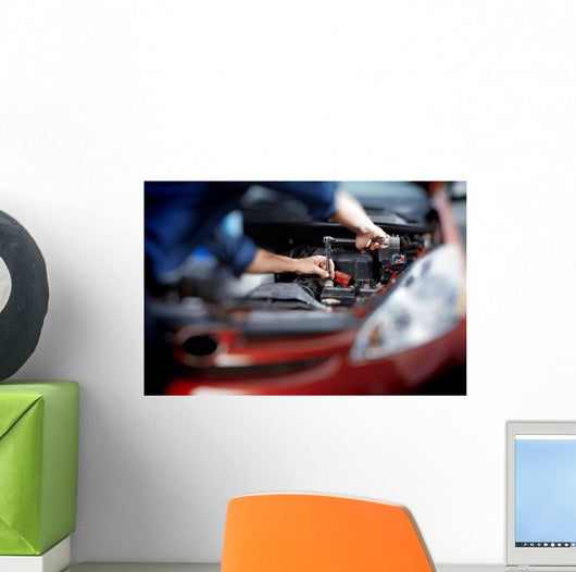 Mechanic working in auto repair garage Wall Decal