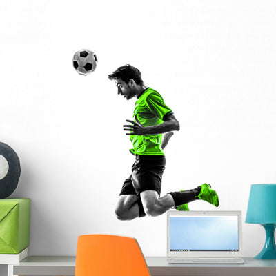 Soccer Football Player Young Man Heading Silhouette Wall Decal shown on a wall