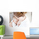 Young mother breastfeeding the newborm baby - indoors Wall Decal