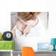 Young mother breastfeeding the newborm baby - indoors Wall Decal