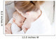 Young mother breastfeeding the newborm baby - indoors Wall Decal