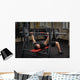 young man doing bench press workout in gym Wall Decal