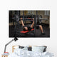 young man doing bench press workout in gym Wall Decal