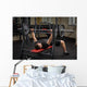 young man doing bench press workout in gym Wall Decal
