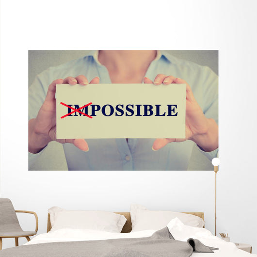 woman hands card crossed off first two letters word impossible Wall Decal