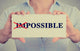 woman hands card crossed off first two letters word impossible Wall Decal