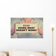 Businesswoman hands holding sign Stop Doing What Doesn't Work Wall Decal