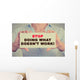 Businesswoman hands holding sign Stop Doing What Doesn't Work Wall Decal