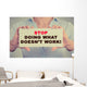 Businesswoman hands holding sign Stop Doing What Doesn't Work Wall Decal