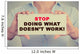 Businesswoman hands holding sign Stop Doing What Doesn't Work Wall Decal