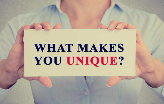 businesswoman hands holding sign message what Makes You Unique? Wall Decal