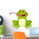 Happy frog cartoon catching fly Wall Decal