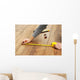 Carpenter worker installing laminate flooring in the room Wall Decal